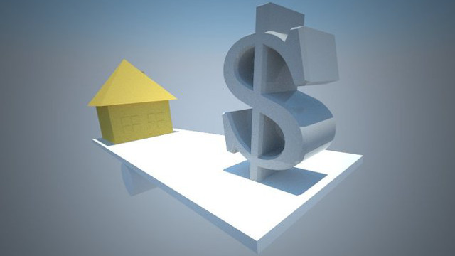 house balanced against dollar symbol